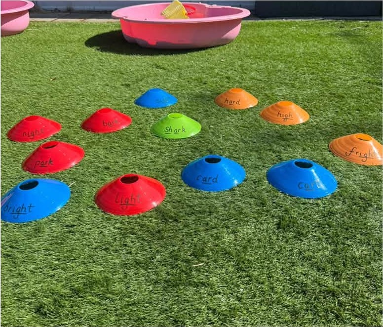 A word game with sports cones in the garden