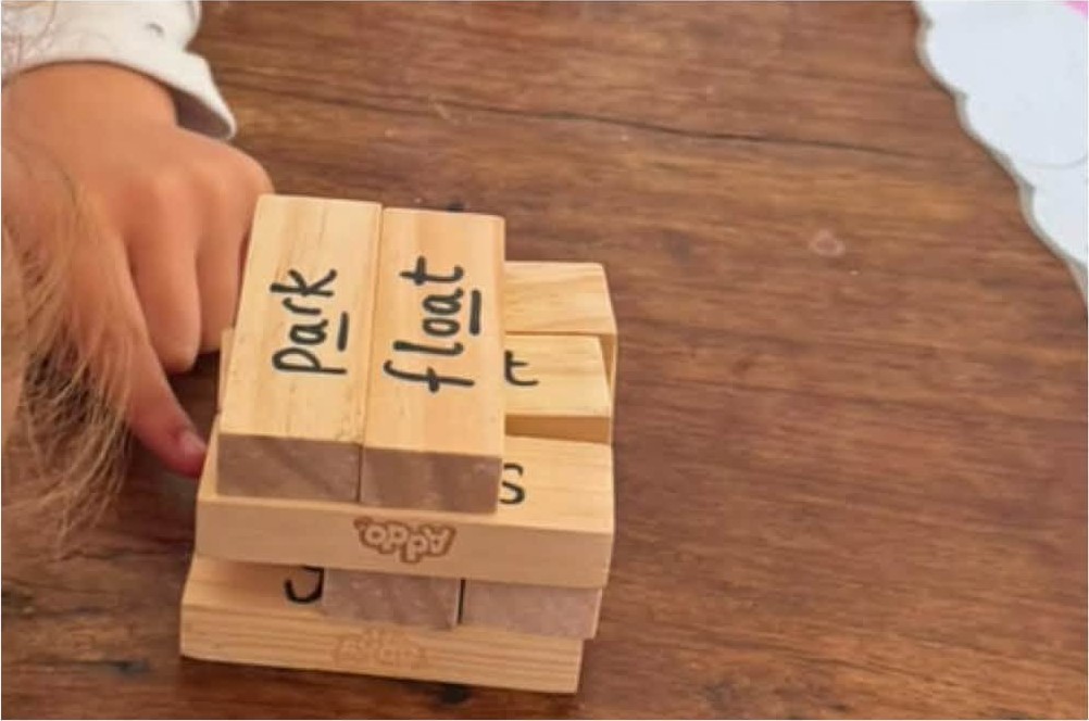 Spelling words with wooden blocks
